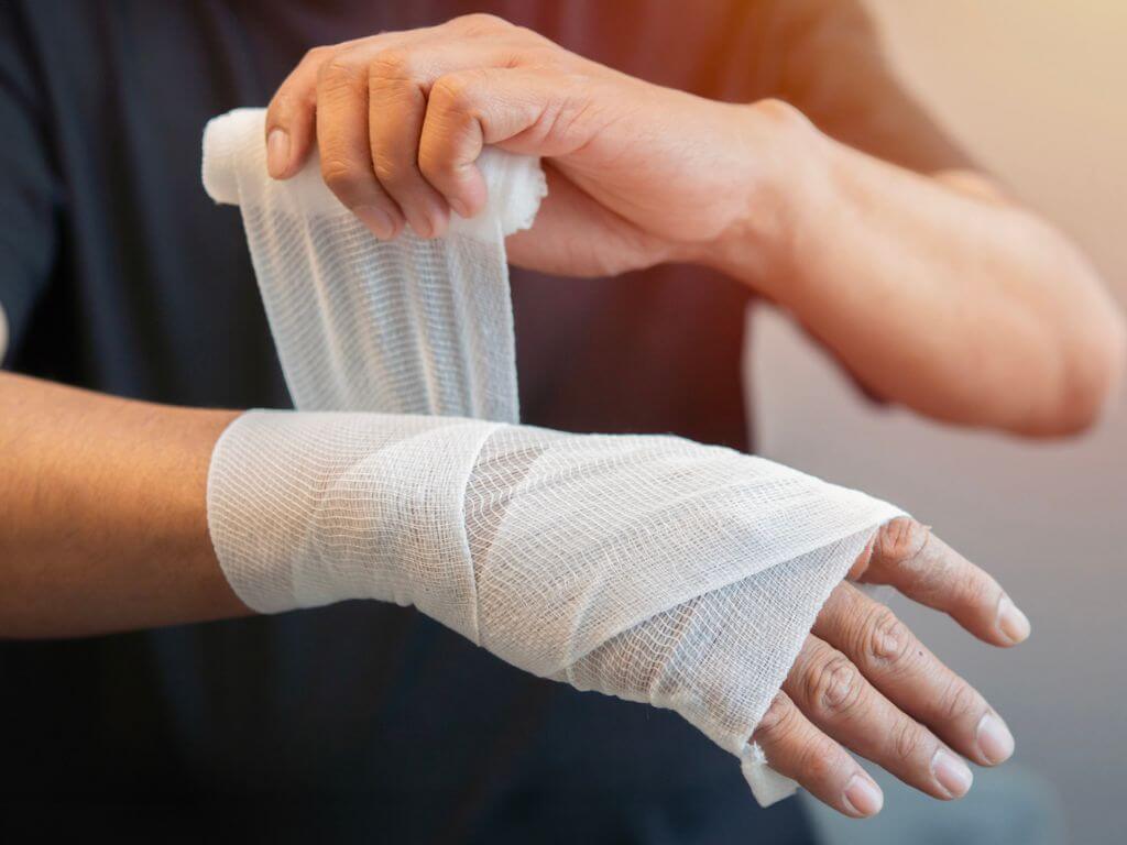 Wet wrap therapy being applied on the arm as part of eczema treatment