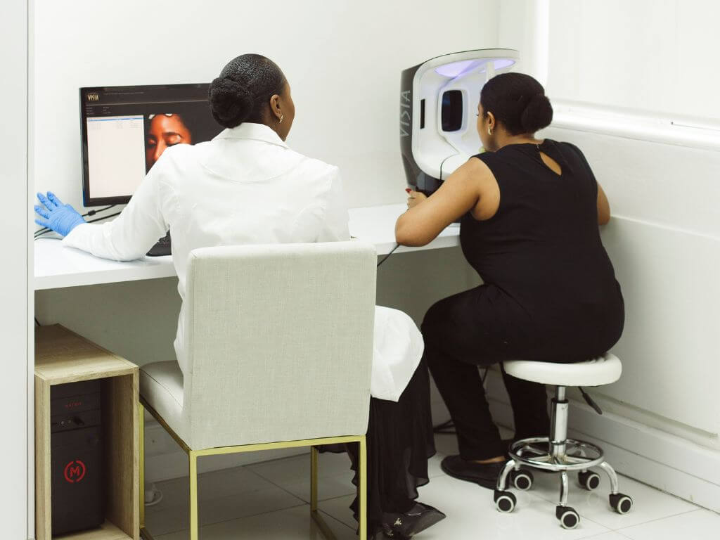 Dermatologist performing a professional skin analysis for menopause skin changes.